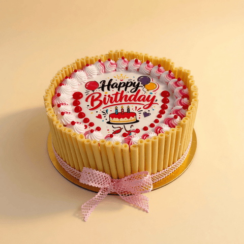 Close view of berry filling and chocolate curls on a birthday cake