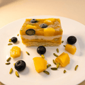 Delicious Mango Ice Cream Cake with Vanilla Cake Layers