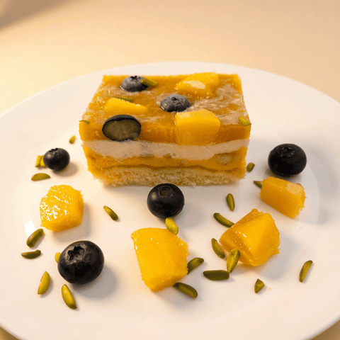 Delicious Mango Ice Cream Cake with Vanilla Cake Layers