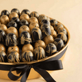 Round Gold Tray of Black and Gold Marble Chocolate