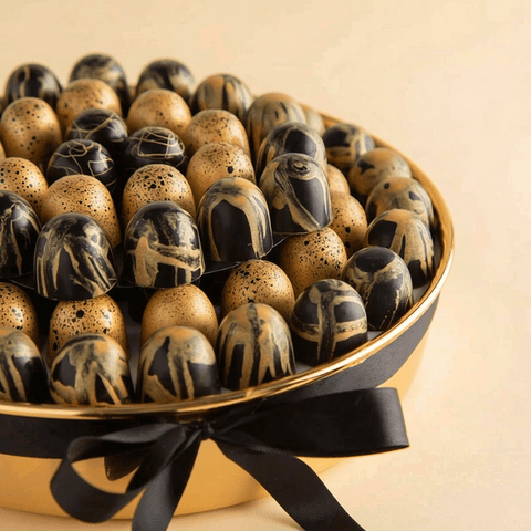 Round Gold Tray of Black and Gold Marble Chocolate