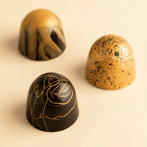 Round Gold Tray of Black and Gold Marble Chocolate
