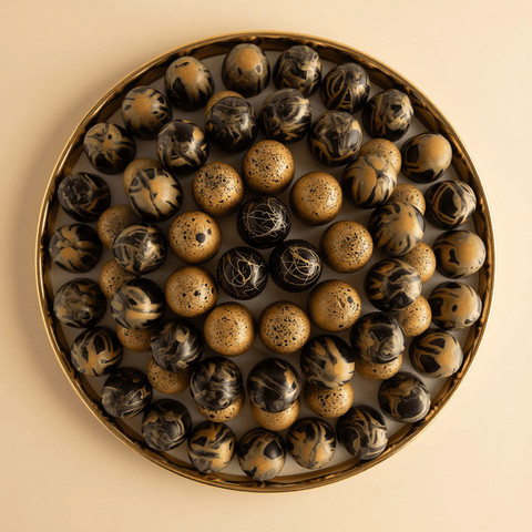 Round Gold Tray of Black and Gold Marble Chocolate