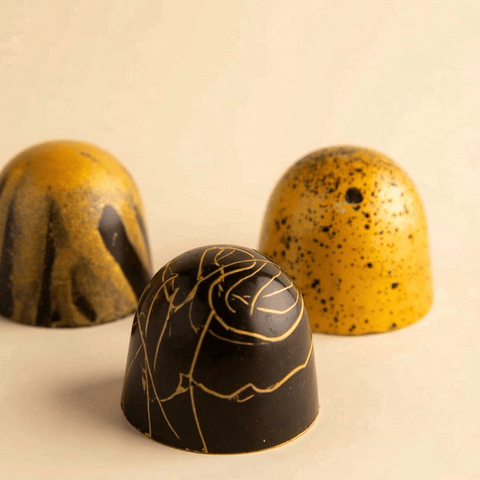 Round Gold Tray of Black and Gold Marble Chocolate